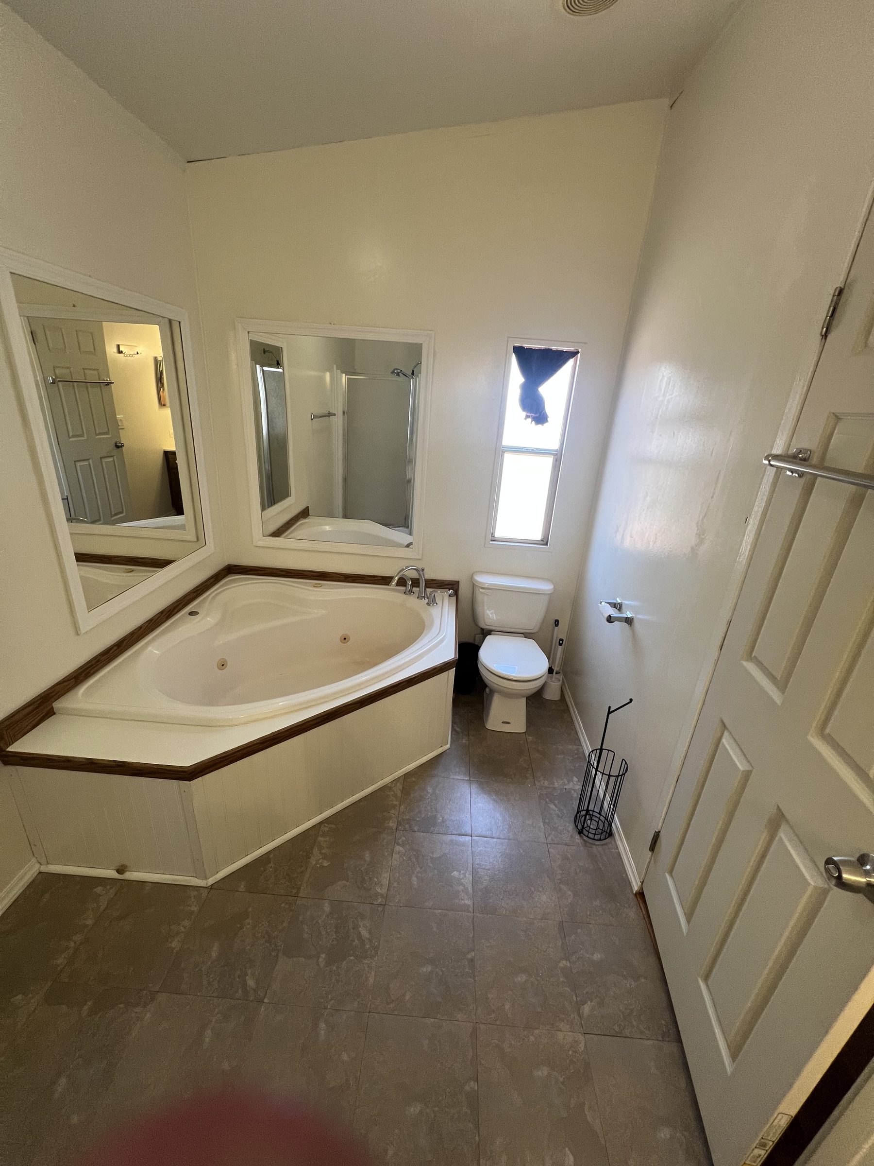 Master bathroom with corner jacuzzi tub