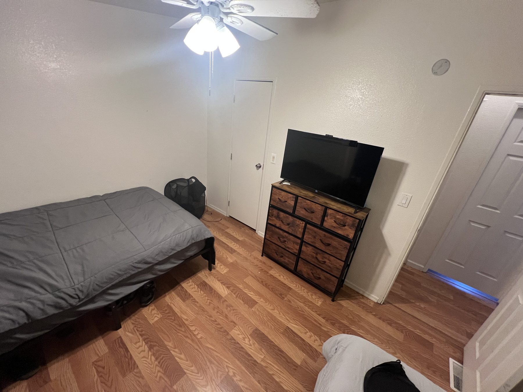 Private bedroom with TV and dresser