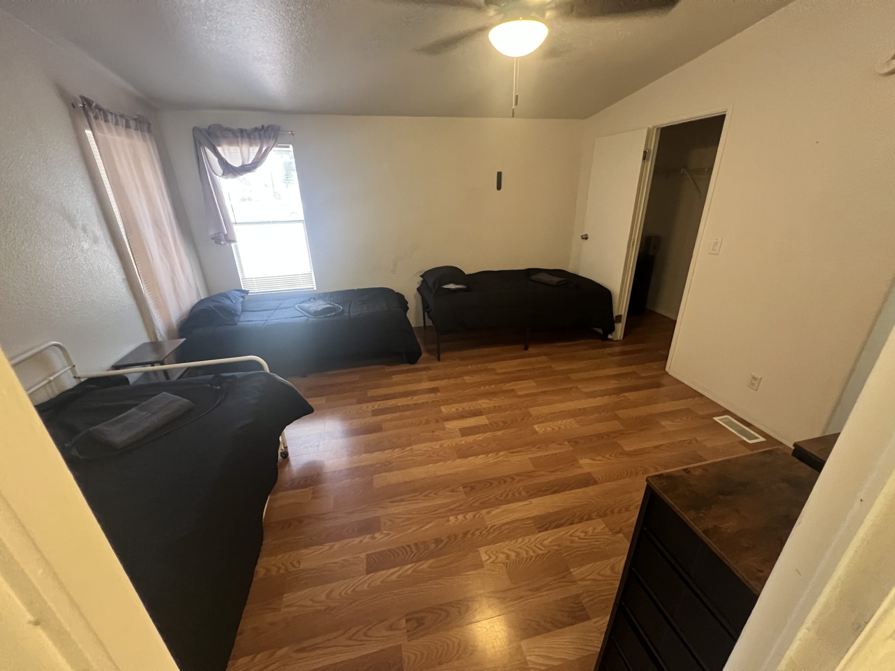 Another shared bedroom with three beds